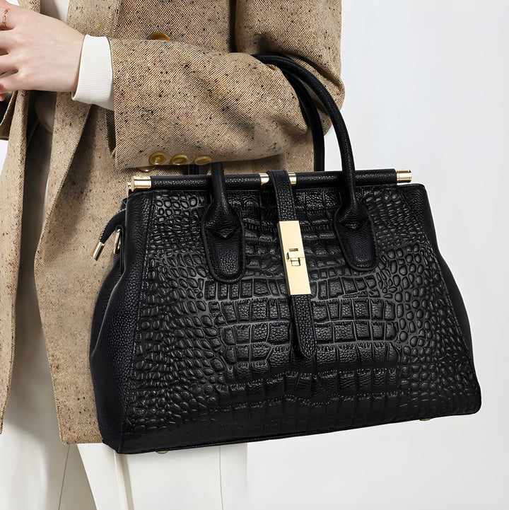 Organized multi-compartment ladies' tote. Stylish alligator embossed leather handbag with ample space.