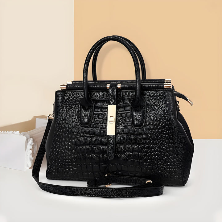 Chic ladies' embossed alligator leather handbag. Structured multi-compartment tote for elegant women's fashion.