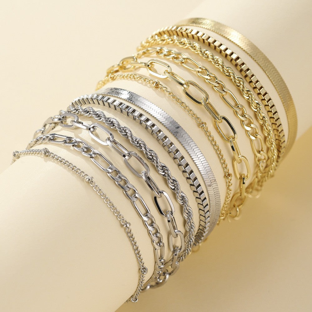 Women's elegant layered bracelet set in gold and white gold tones. Fashionable, versatile jewelry for any occasion.