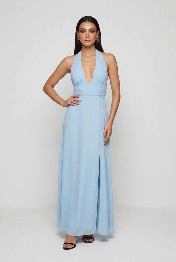 Elegant light blue halter neck backless maxi dress with a high slit, perfect for summer parties or evening events.