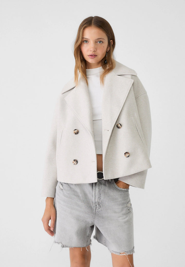 Elegant lightweight double-breasted summer jacket for women. Chic outerwear for warm weather style.