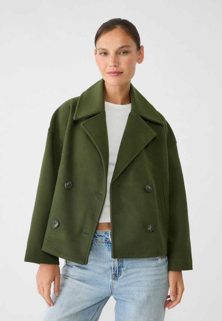 Chic double-breasted short jacket for women. Versatile elegant outerwear for summer fashion.