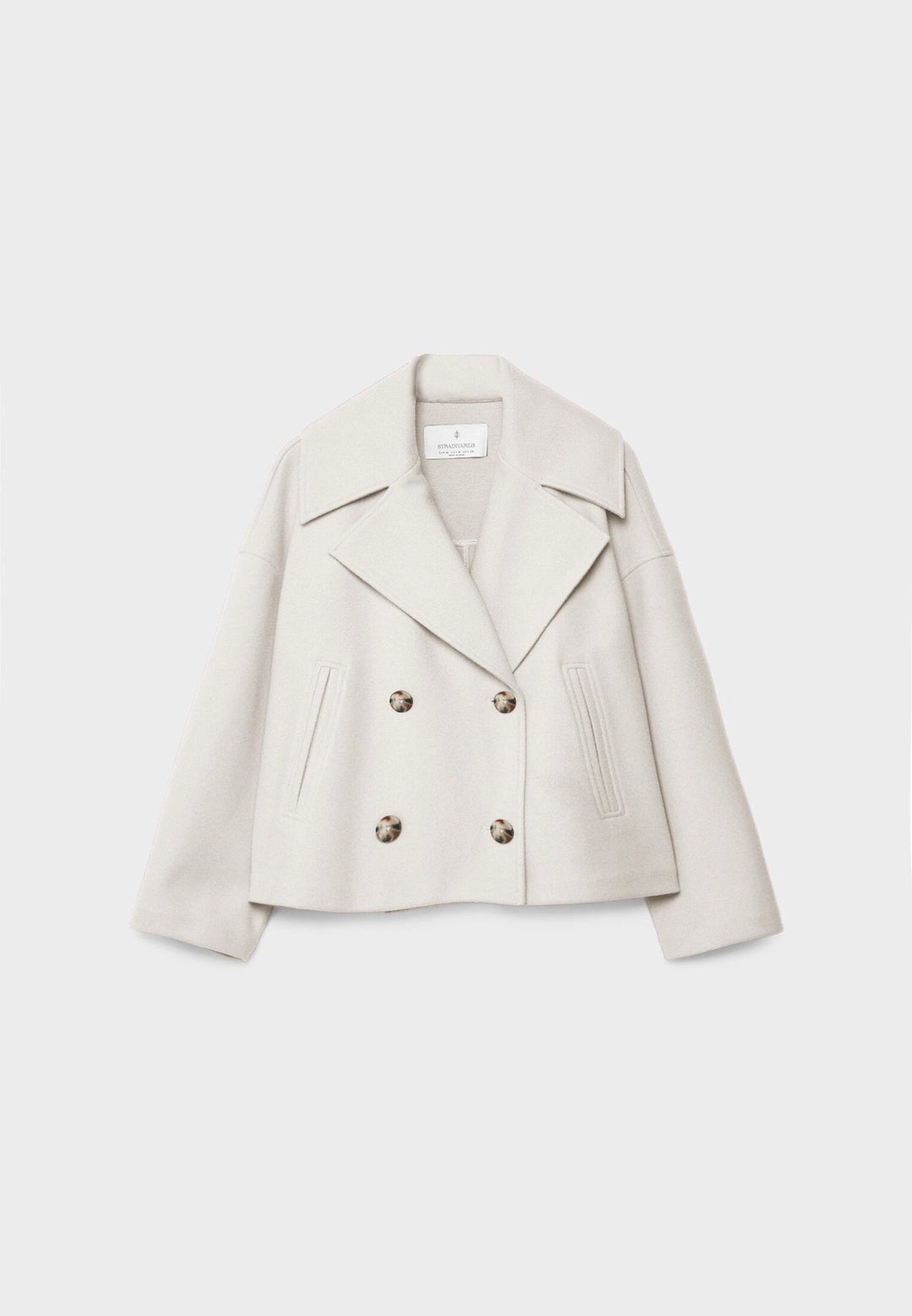 Back of women's elegant lightweight double-breasted summer jacket. Chic and flattering summer style.
