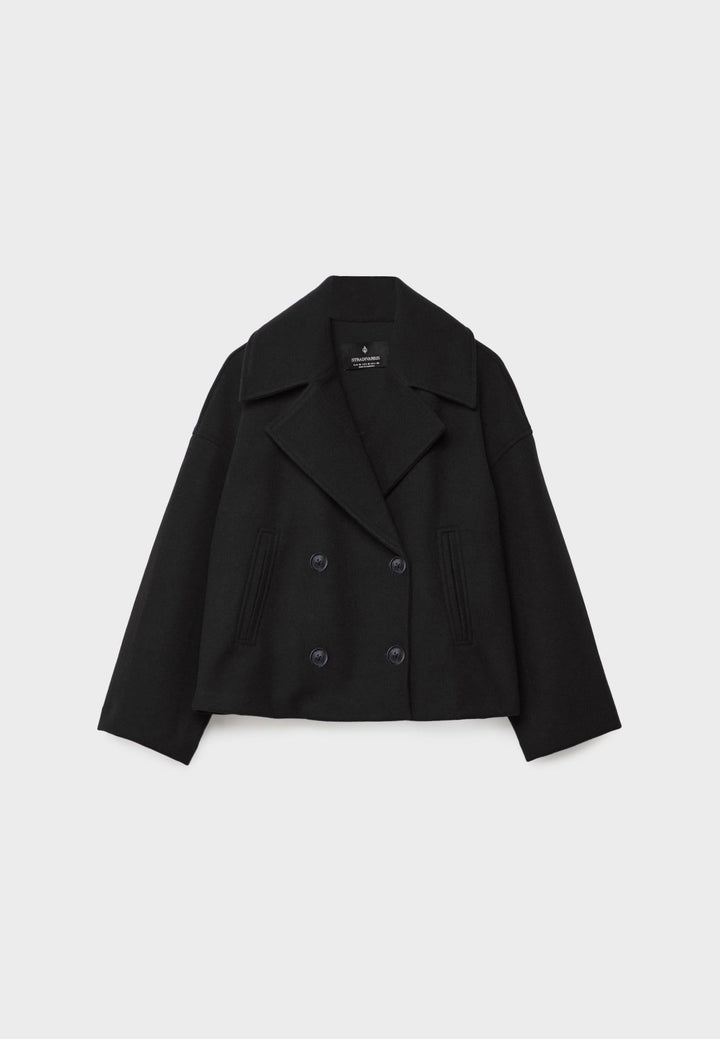 Front view: Women's double-breasted summer jacket. Elegant lightweight design with stylish button detail.