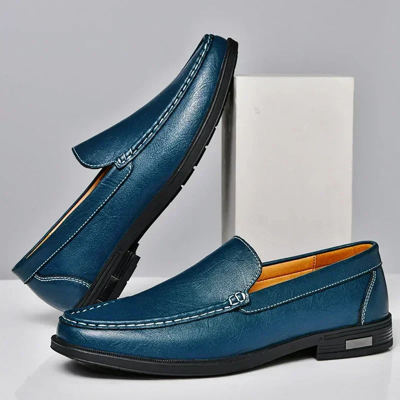 Fresh white elegant men's loafers, classic slip-on design for comfortable, stylish casual and dress wear.