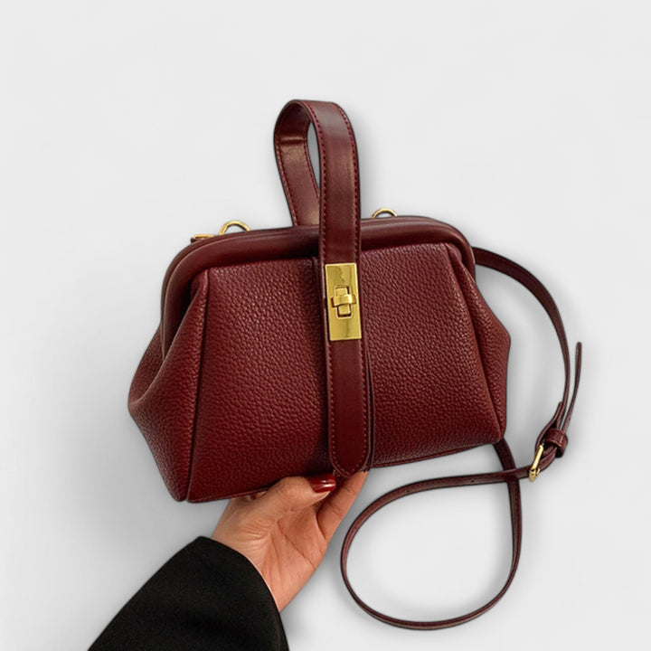 Sleek black mini handbag, an elegant statement piece for any fashion-conscious woman.