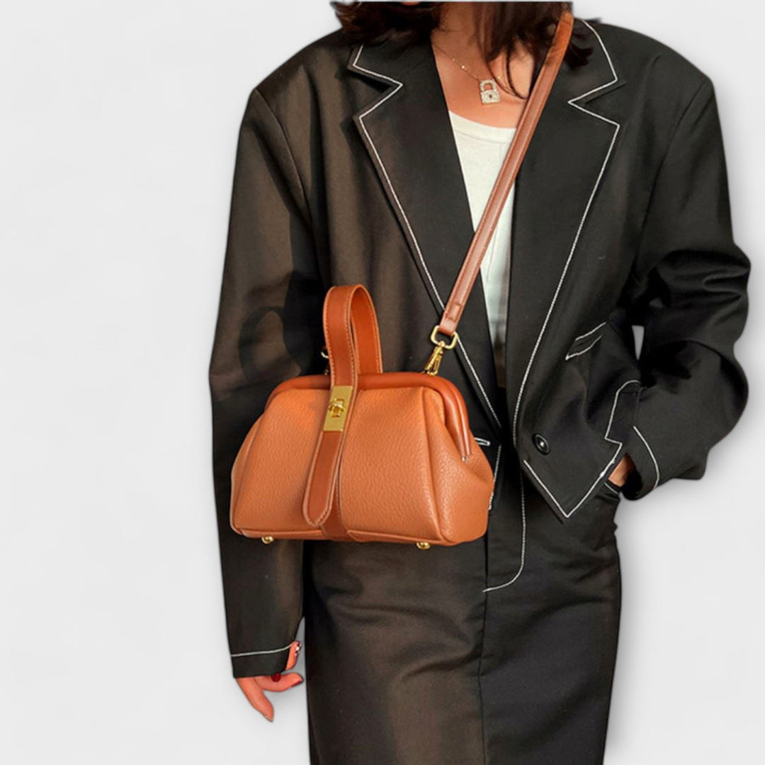 Stylish PU leather mini handbag in black, an elegant essential for women.