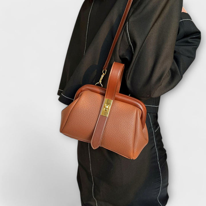 Black elegant mini handbag for women, a chic shoulder bag for summer outfits.
