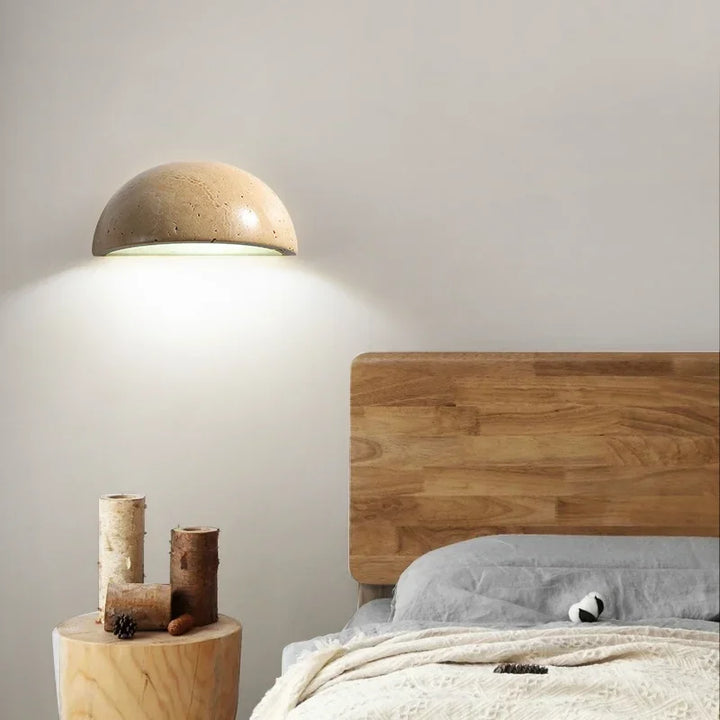 Chic stone LED wall light with energy-efficient design, adding a modern and warm glow to any interior space.