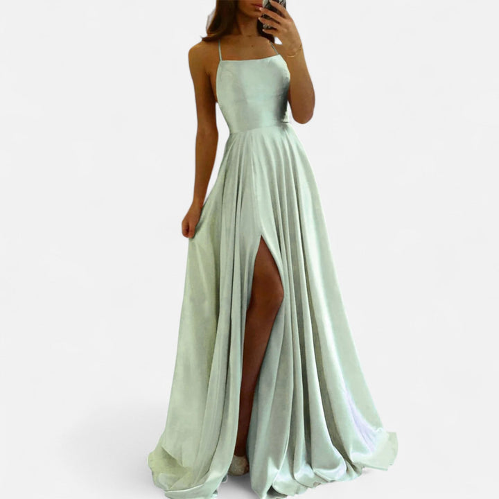 Elegant navy blue maxi wedding guest dress with a thigh-high slit, perfect for formal summer events
