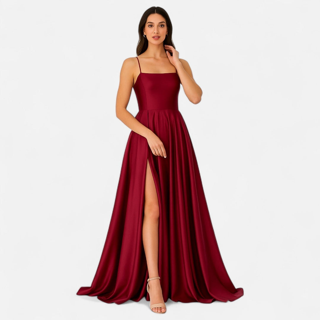 Burgundy formal evening gown with a flattering slit, designed for women attending weddings