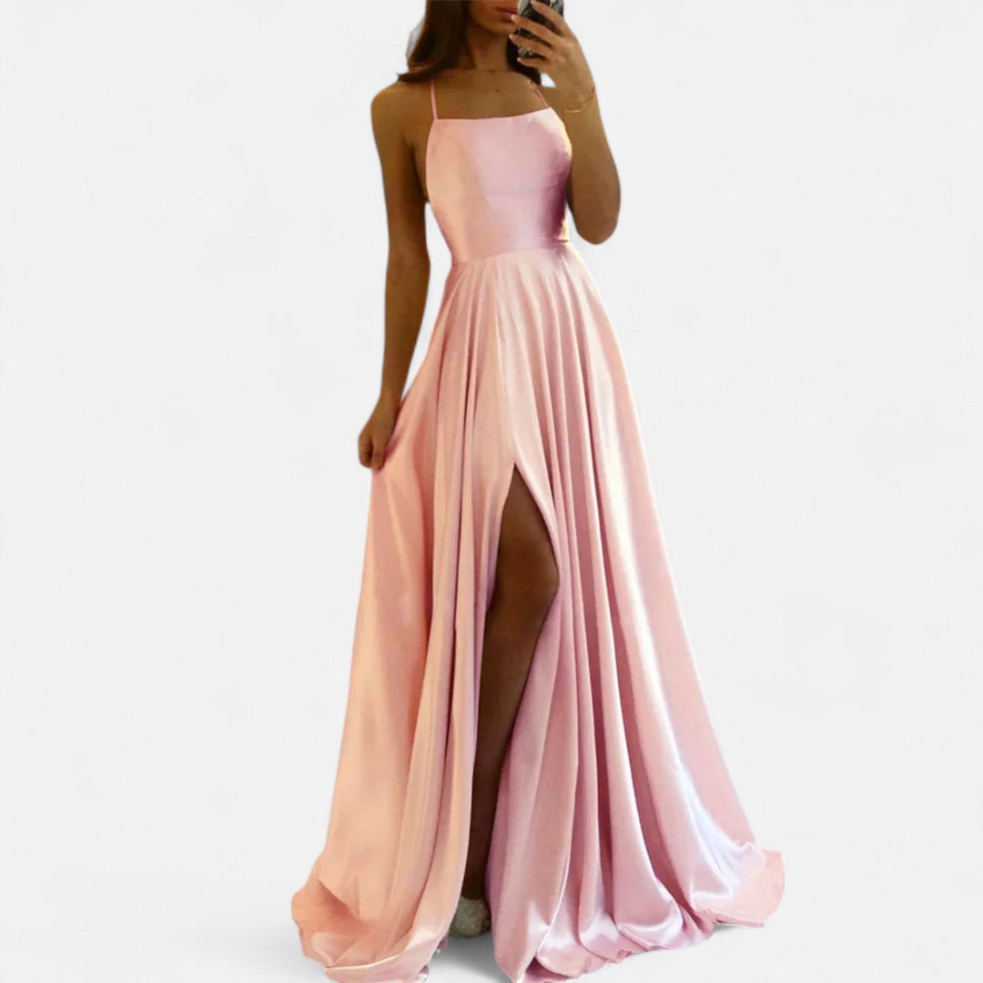 Back view of a graceful white maxi dress with a slit, a stunning formal or party dress for women