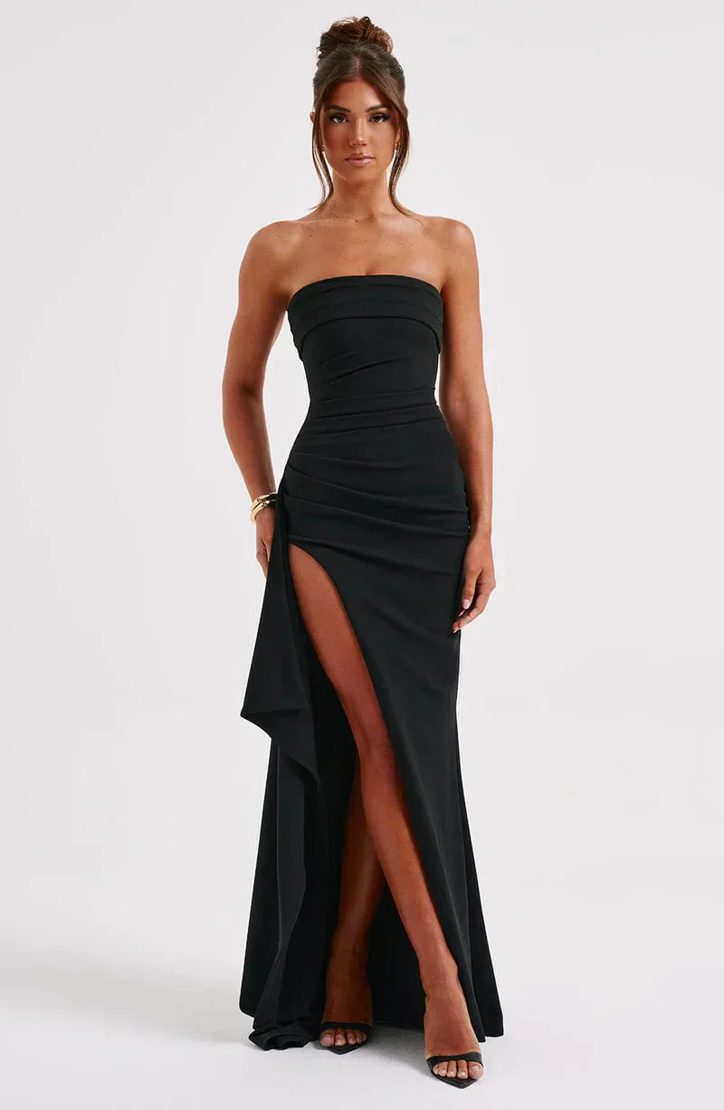 Chic women's party dress: black off-shoulder maxi with a twisted front, perfect for special occasions.