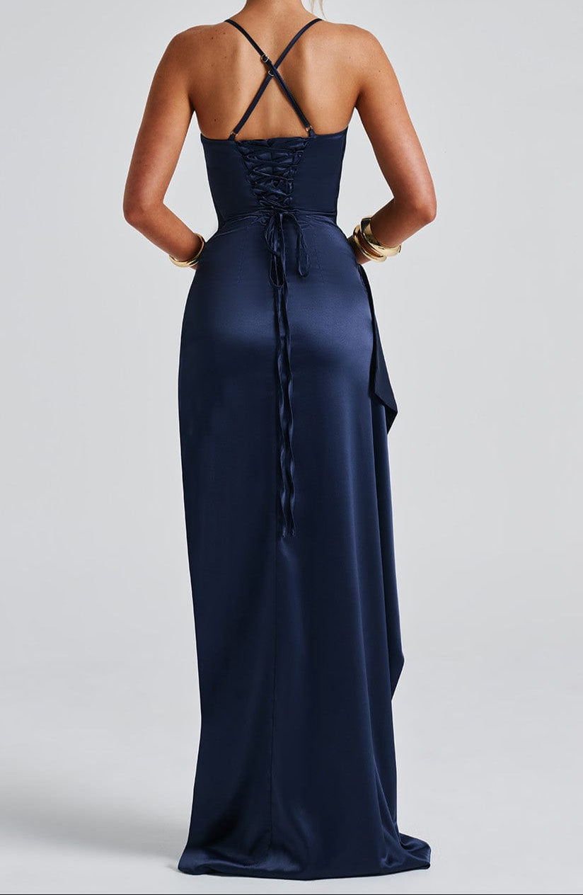 Close-up of the fabric texture of a navy blue women's high slit maxi evening gown.