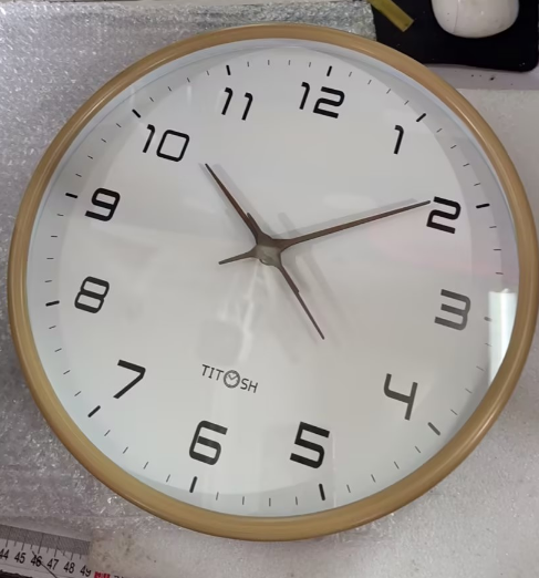 Chic modern wooden wall clock with a minimalist Nordic design, ideal for elegant home decor. Silent operation.