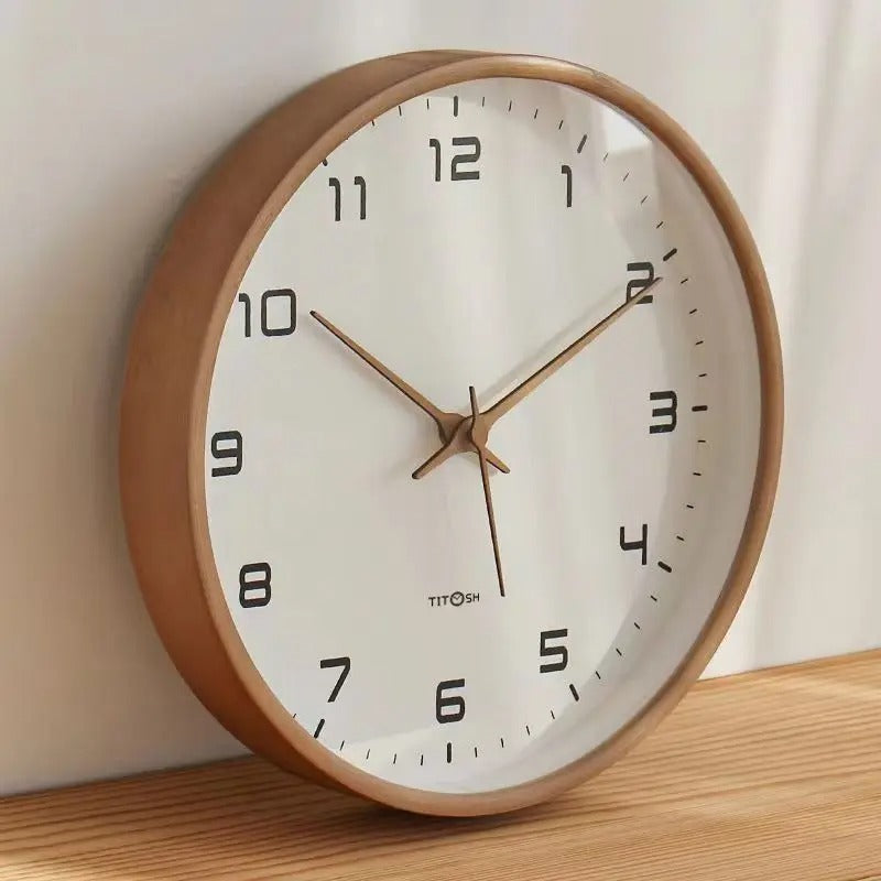 Silent wooden wall clock, a minimalist Nordic decor piece in natural brown/cream. Modern quartz mechanism.