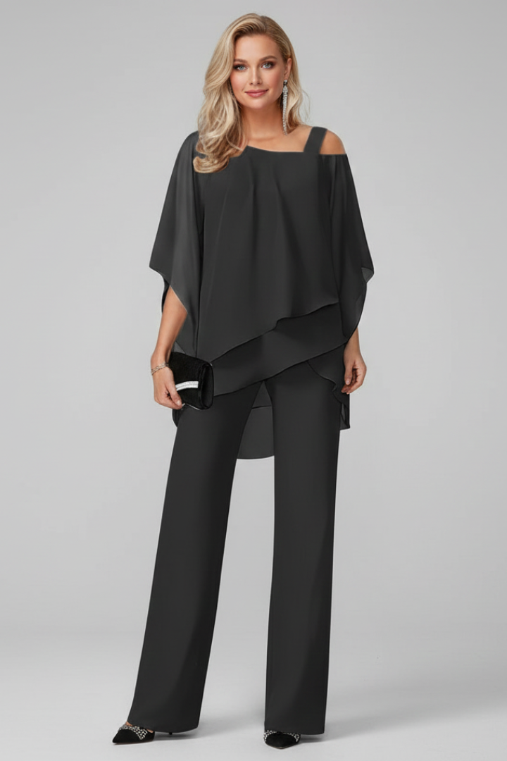 Flowing black off-shoulder wide-leg jumpsuit, a stylish option for party and holiday fashion.