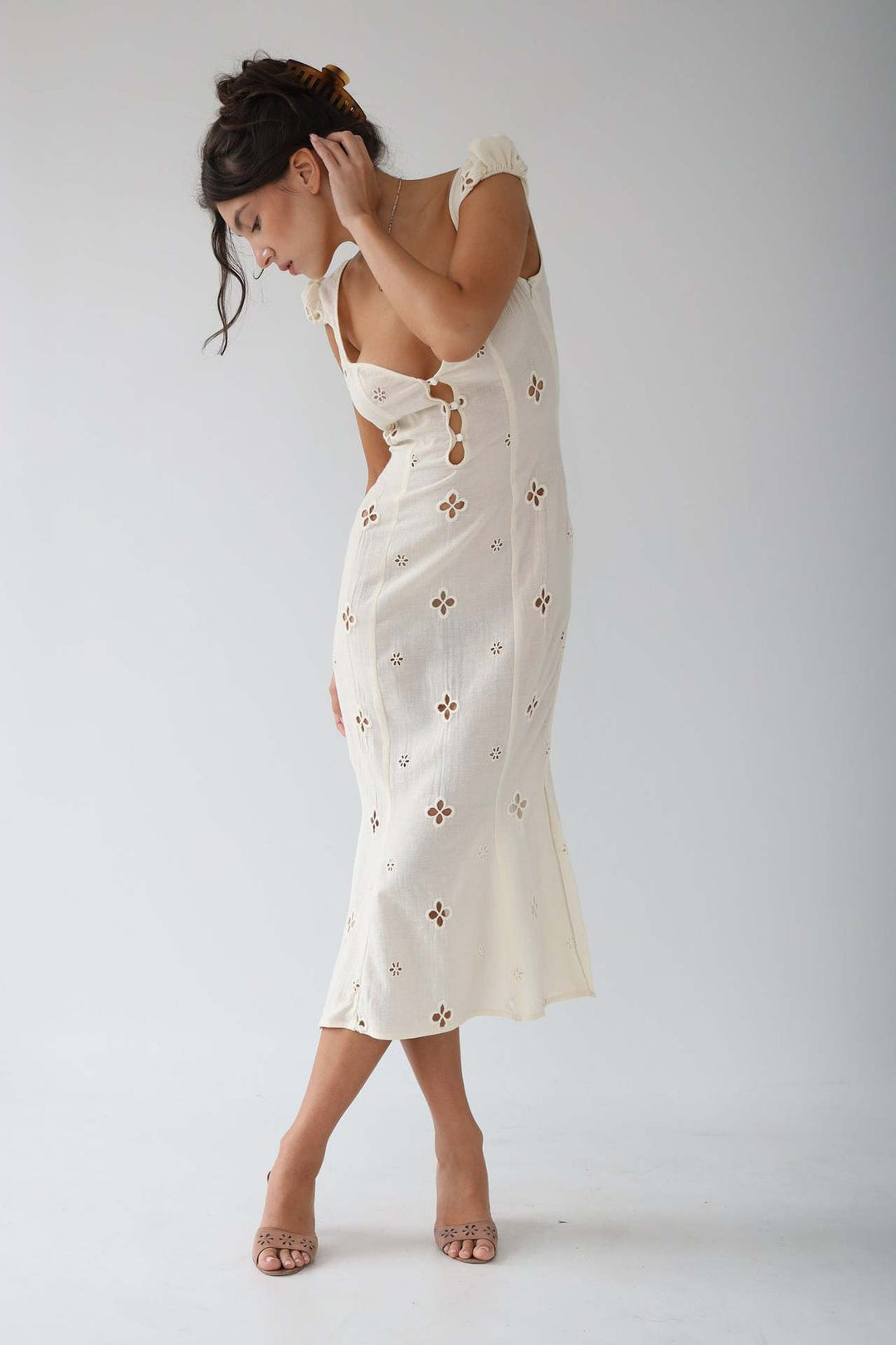 Full-length white occasion wear mermaid dress, featuring a fitted bodice and flared hem; a perfect formal gown.