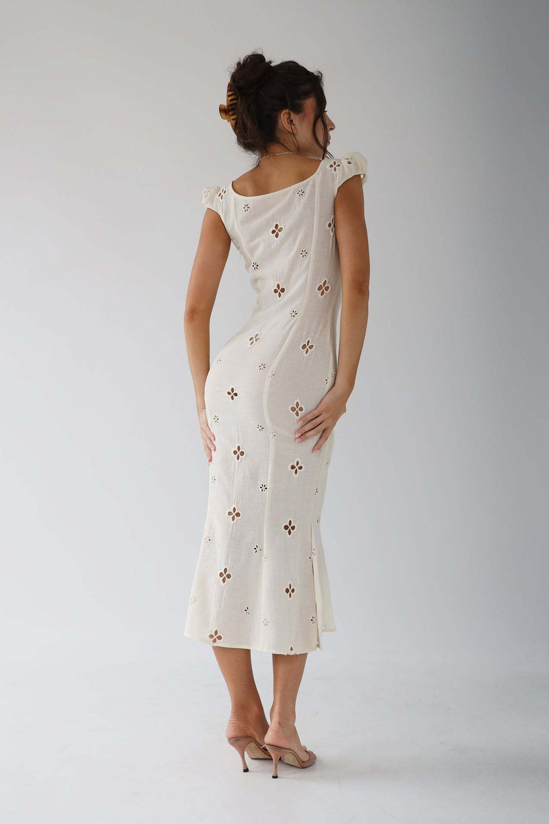 Mermaid wedding guest dress in pristine white, a classic and elegant choice for any formal summer gathering.