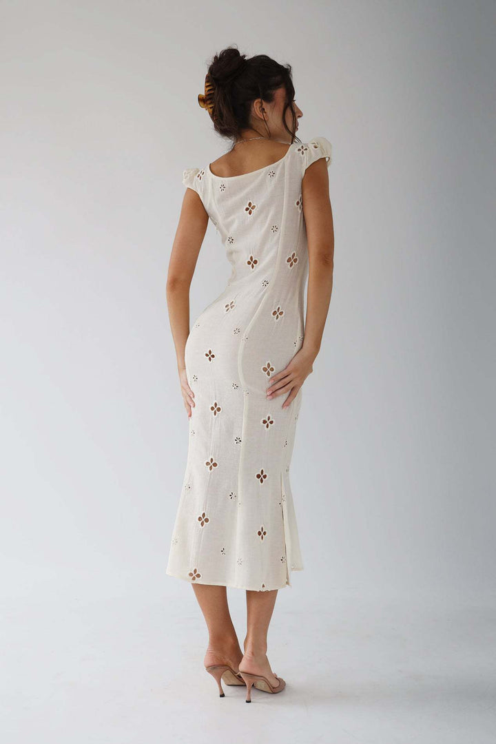 Mermaid wedding guest dress in pristine white, a classic and elegant choice for any formal summer gathering.