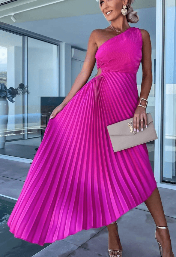 Close-up of the pleated detail on an elegant one shoulder maxi dress for formal events