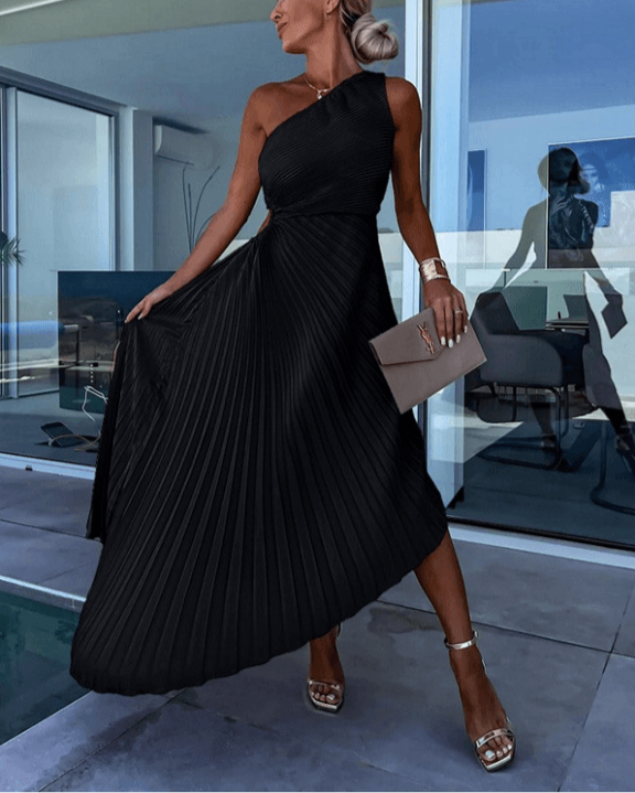 Model wearing a graceful one shoulder pleated maxi dress, showcasing its elegant drape