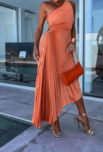Stunning one shoulder maxi dress with full pleated skirt, a chic summer formal dress option