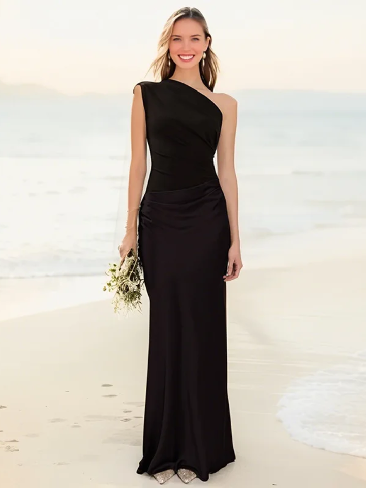 Back view of a white one-shoulder satin maxi dress, showcasing its elegant silhouette.