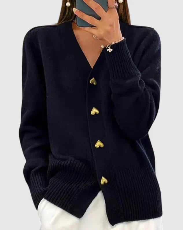 Close-up of the stylish knit texture on an open front elegant women's cardigan sweater.