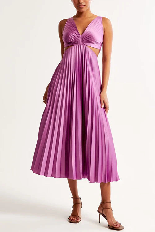 Model wearing a new elegant pleated maxi dress, flowy summer gown with cut-out waist, occasion wear