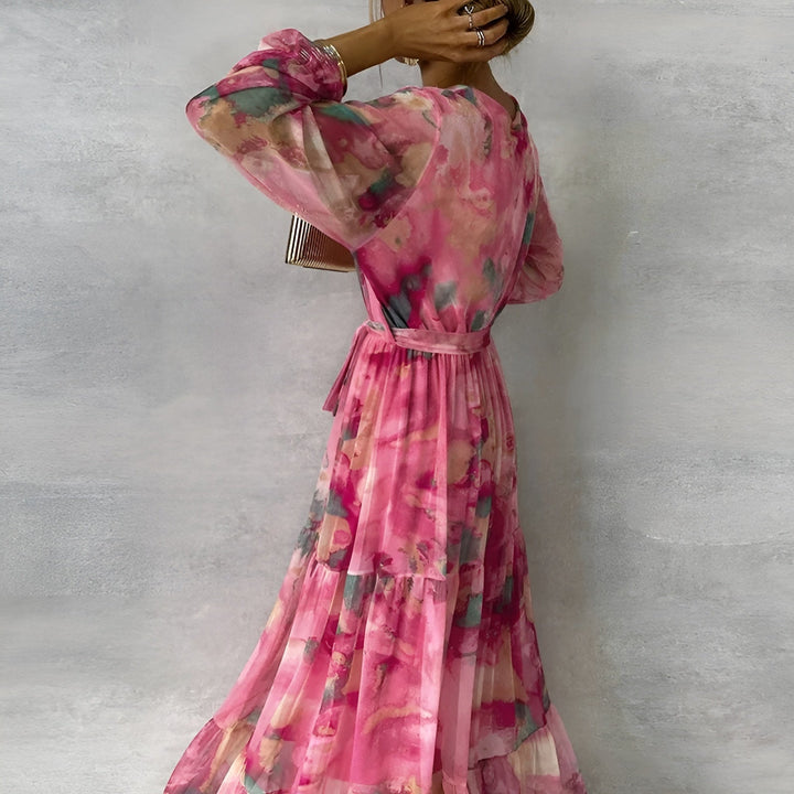 Chic pleated midi dress for women, ideal for summer, features a delicate floral pattern