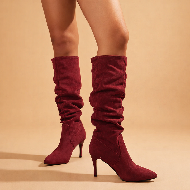 Elegant red women's slouch knee-high boots with pointed toe & stiletto heel, perfect fashion winter footwear.