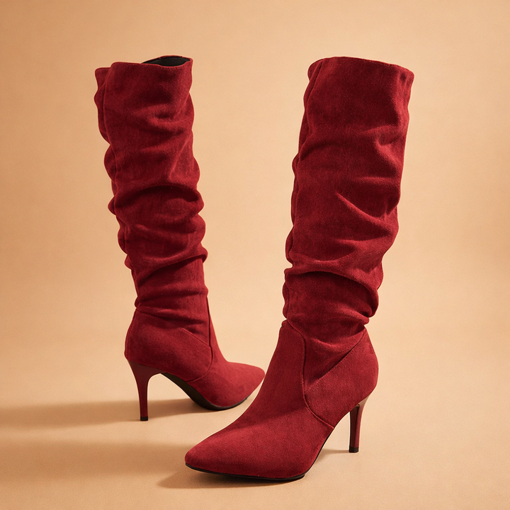 Chic women's slouch knee-high heeled winter boots with an elegant pointed toe and stiletto heel.