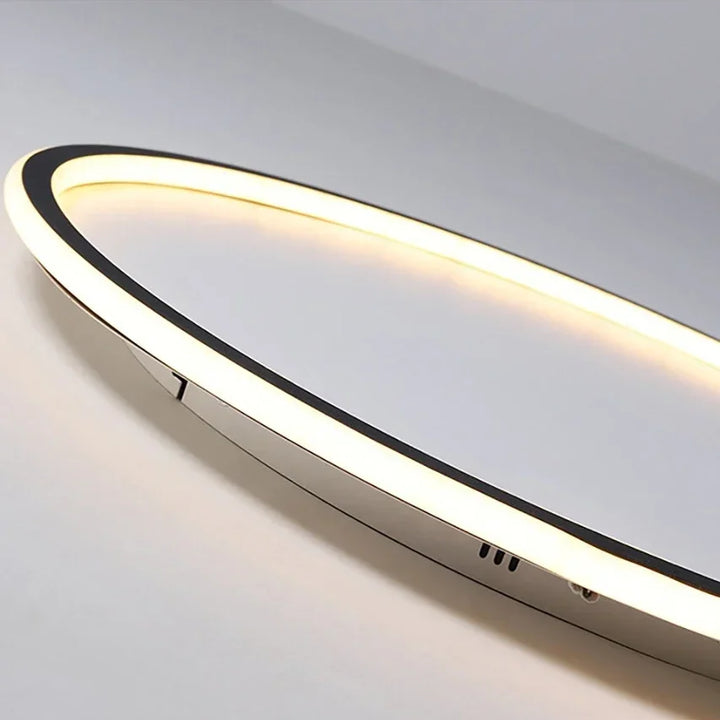 Cool white LED ceiling light, minimalist round design, bright interior illumination.