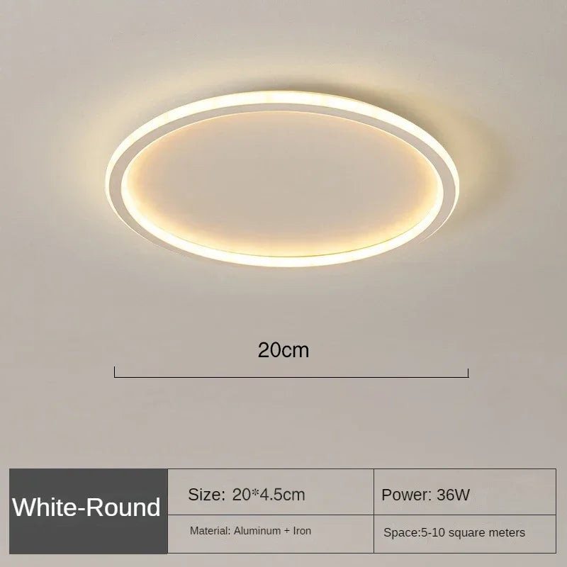 Modern round LED ceiling fixture, white, clean lines, ideal for bedroom or living room.