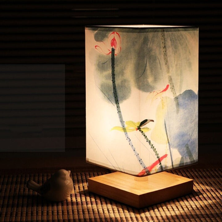 Minimalist tabletop lamp with a decorative Japanese print shade. Enhances any interior with soft mood lighting.