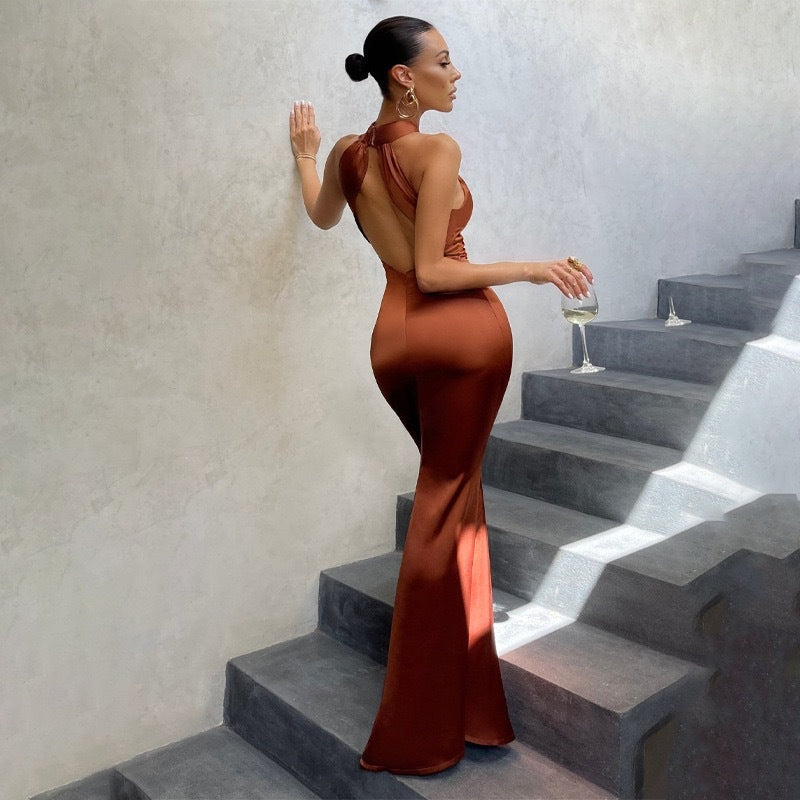Sleek and elegant sleeveless fishtail evening dress with a sophisticated open back detail.