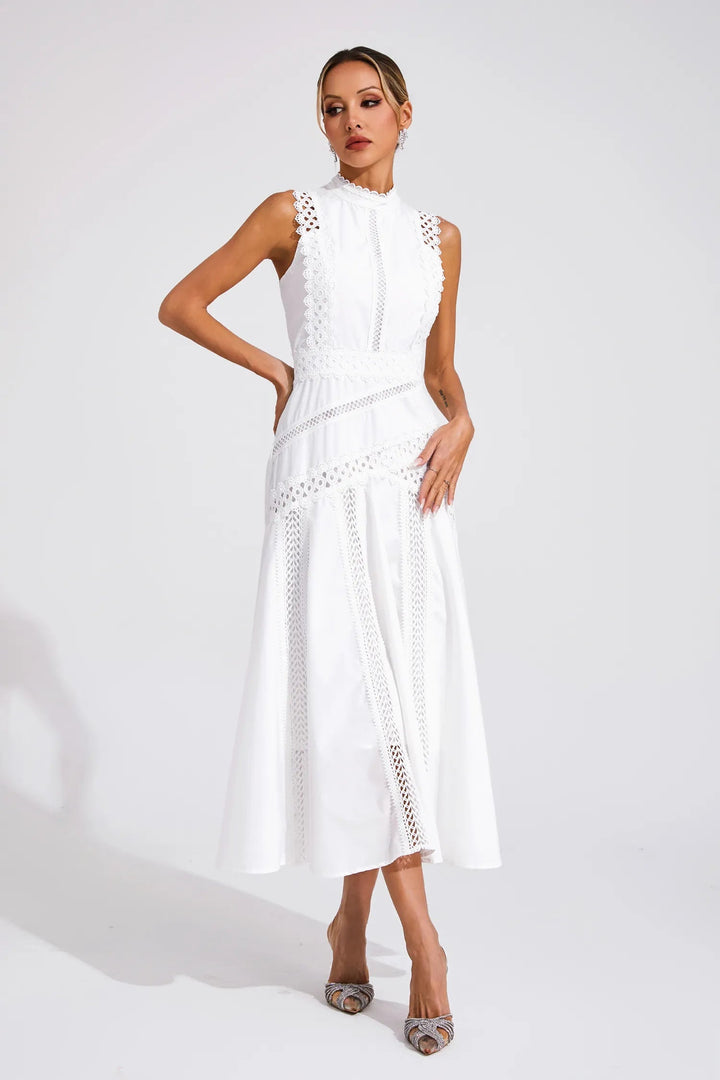 Full-body view of an elegant sleeveless white lace cocktail dress, emphasizing its flow and fit.