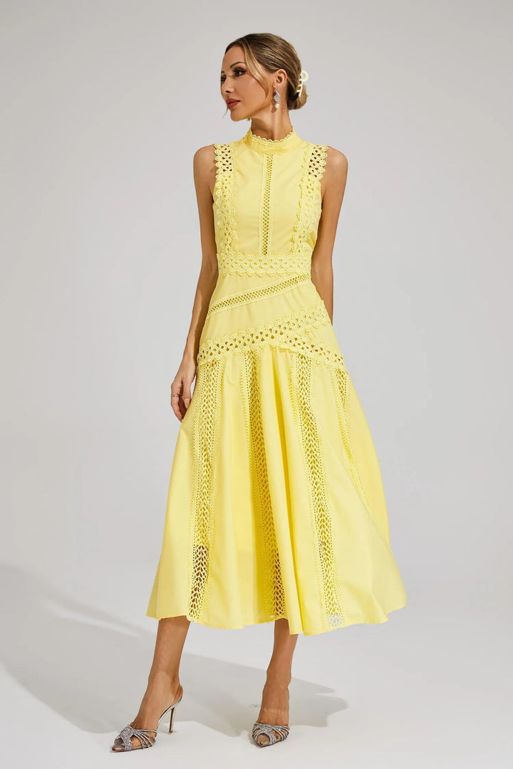 Women's elegant sleeveless yellow lace cocktail dress, radiating sophistication and charm at parties.
