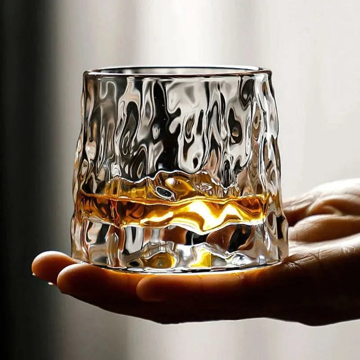 Clear, hand-blown Edo glass spinning whiskey tumbler, perfect for swirling bourbon and spirits, a modern Japanese barware.