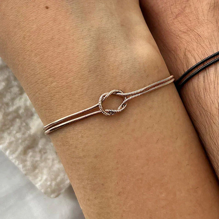 Delicate rose gold stainless steel knot bracelet, a stylish and subtle accessory for her.