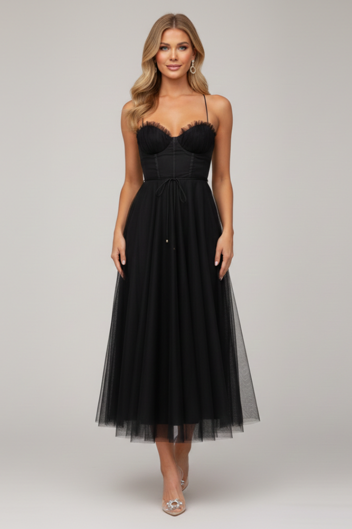 Close-up of the delicate tulle fabric on a women's strapless maxi dress, highlighting its quality.