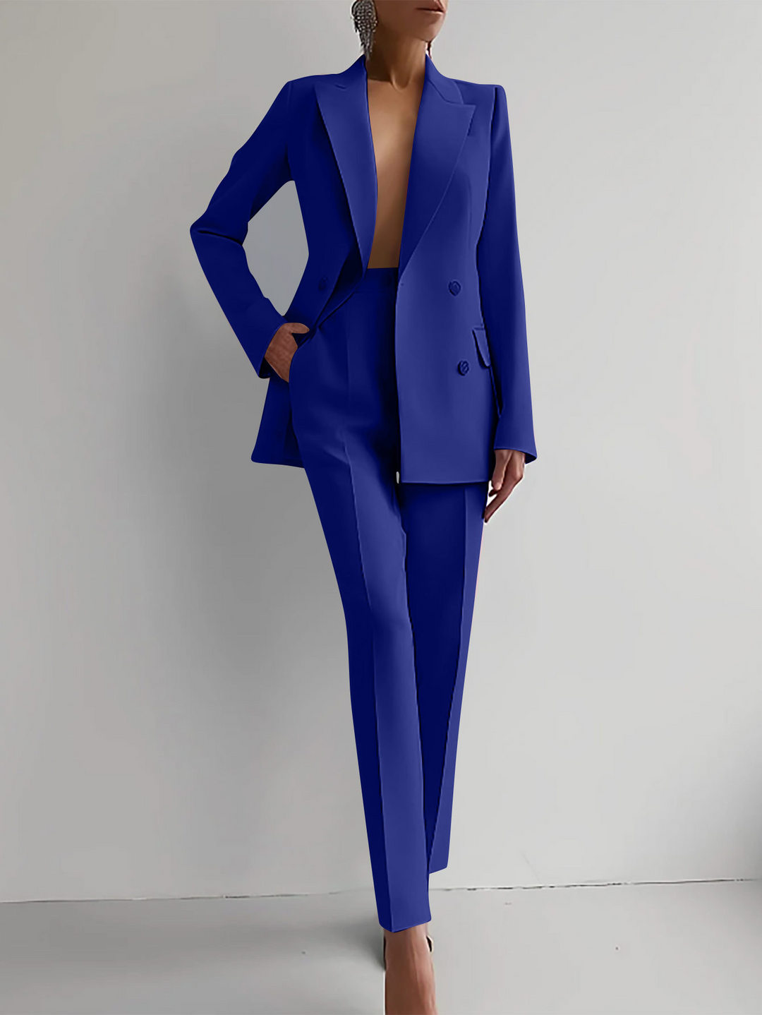 Stylish women's suit with a tailored blazer and trousers, a versatile two-piece formal wear option.