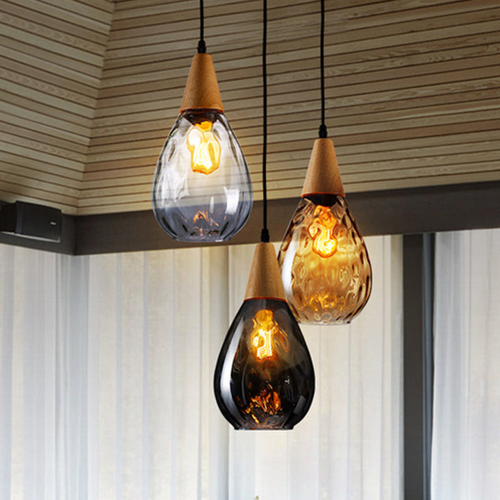 Elegant teardrop glass pendant light, modern home decor ceiling lamp.