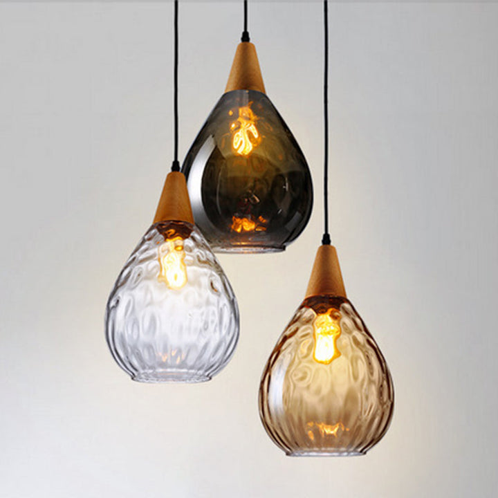 Versatile teardrop glass hanging light, suitable for modern kitchens.