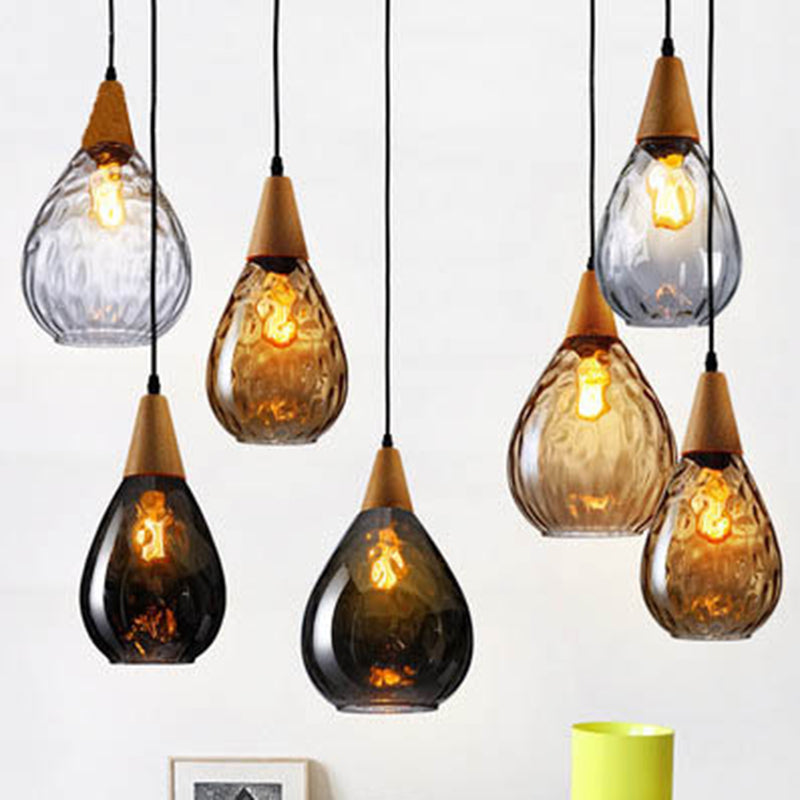 Stylish teardrop glass pendant, perfect modern lighting for any room.