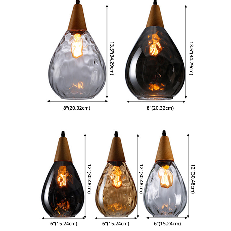 Elegant teardrop glass ceiling lamp, perfect for dining room ambiance.