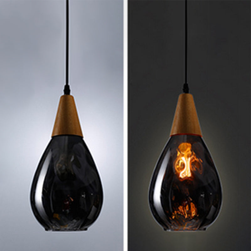 Contemporary teardrop glass hanging light, ideal for modern home decor.