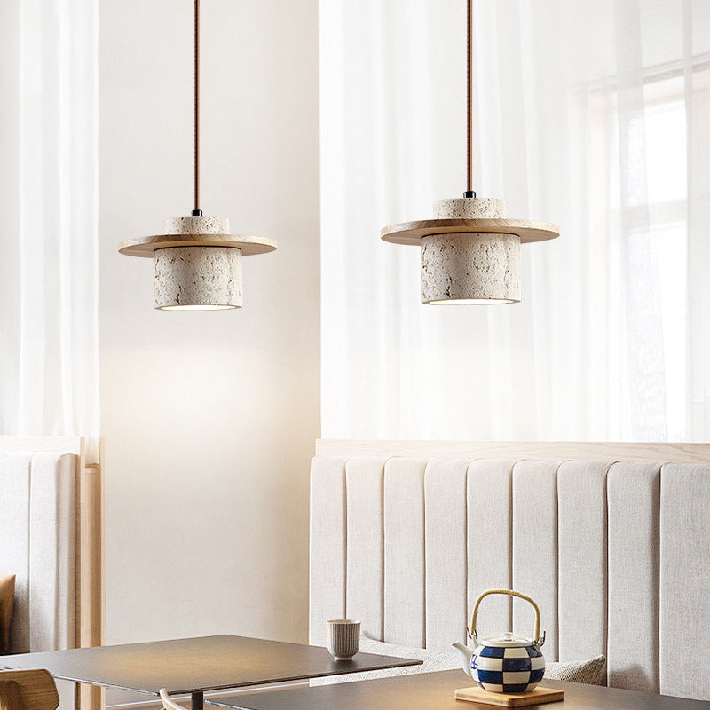 Natural Stone Pendant Light: Unique travertine shade & wood detail, providing warm LED ambient lighting.