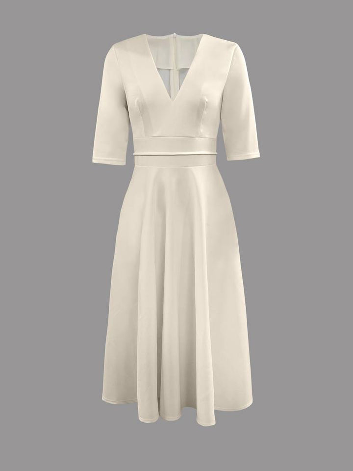 Women's elegant white flared midi dress, perfect as a wedding guest dress or summer formal wear.